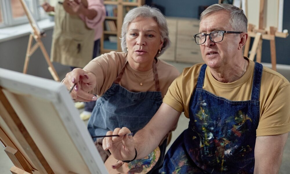 High,Angle,Portrait,Of,Senior,Couple,Painting,Picture,On,Easel How much should you contribute to your pension?